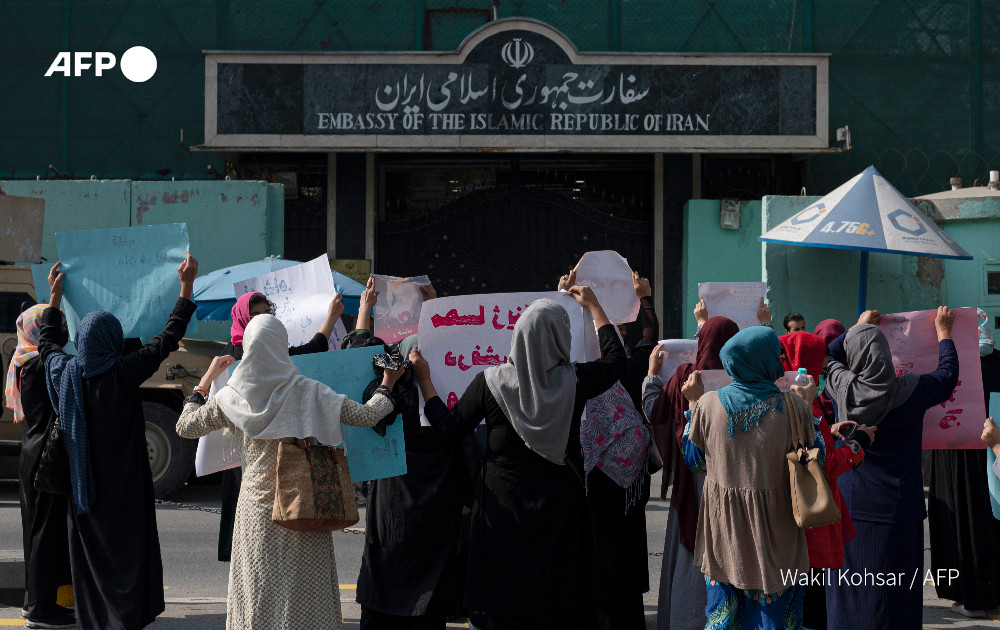 Taliban forces fire shots into the air to disperse a women's rally supporting protests in Iran over the death of a woman in the custody of morality police.  Chanting the Women, life, freedom. mantra used in Iran, Afghan women protested outside Iran's embassy in Kabul