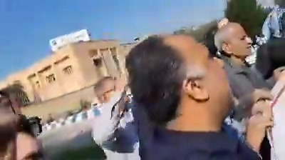 Protest by retirees of the Social Security Organization in Ahvaz. Protesters chant, Enough with the warmongering, our tables are empty