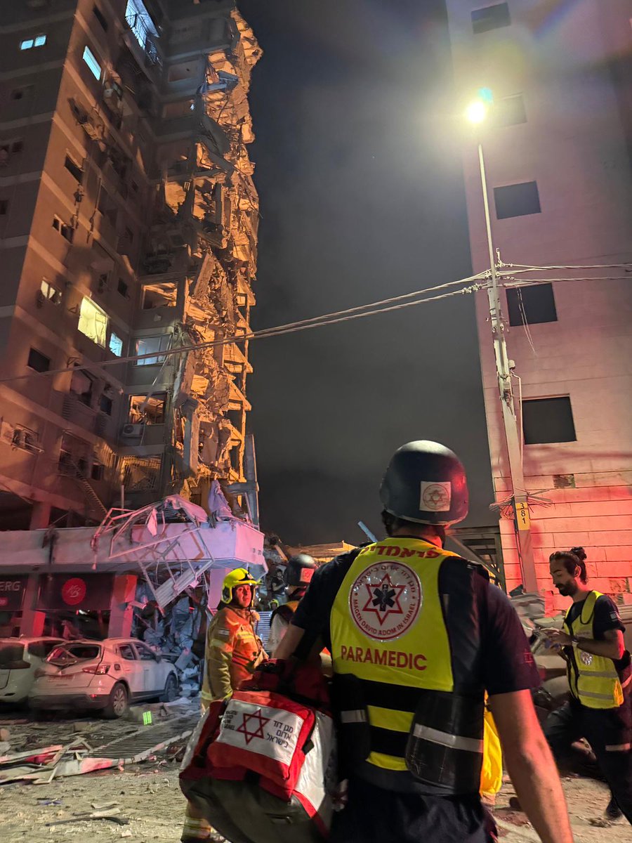 An Iranian ballistic missile impact on a building in the central city of Bat Yam overnight killed four people, including two children, and wounded nearly 100 others, Magen David Adom says.  Another missile impact in Rehovot wounded 37, MDA says.  Among the wounded, six are listed in serious condition.
