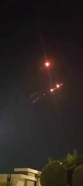 Incoming Iranian ballistic missiles and interceptions seen earlier over Central Israel