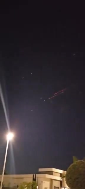 Incoming Iranian ballistic missiles and interceptions seen earlier over Central Israel
