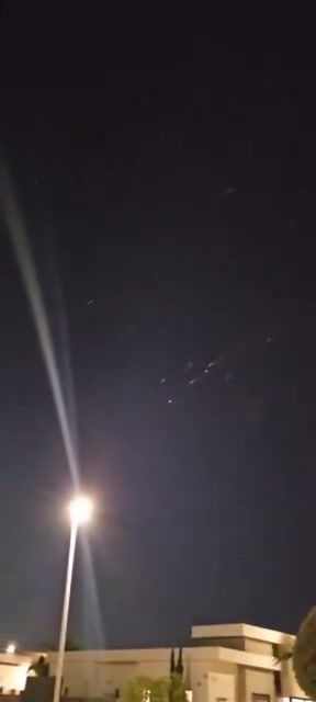 Incoming Iranian ballistic missiles and interceptions seen earlier over Central Israel