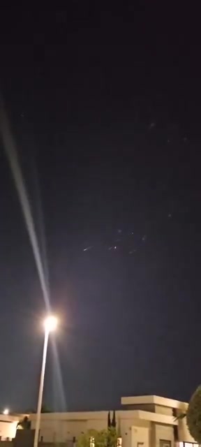 Incoming Iranian ballistic missiles and interceptions seen earlier over Central Israel