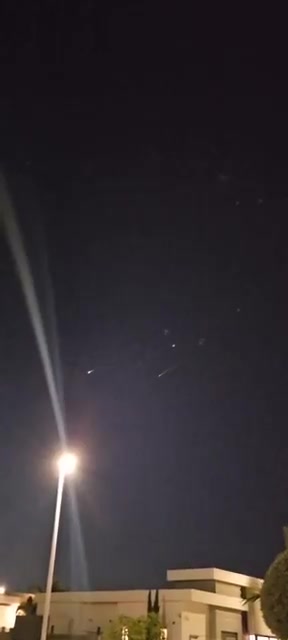 Incoming Iranian ballistic missiles and interceptions seen earlier over Central Israel