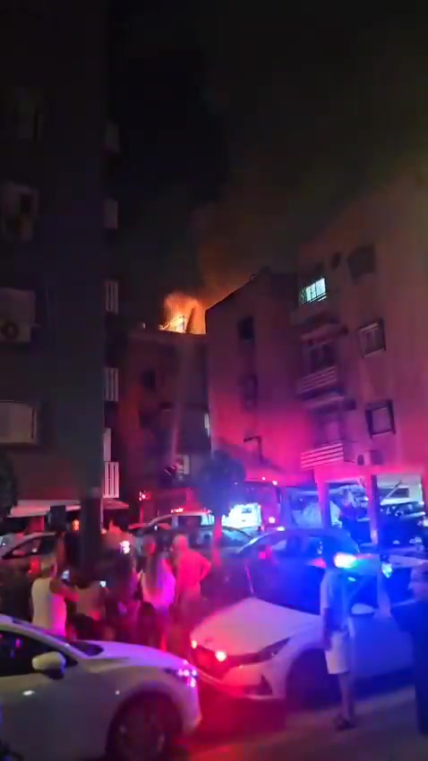 A fire broke out on the roof of a building in central Israel after debris from an interceptor fell during the latest Iranian missile attack
