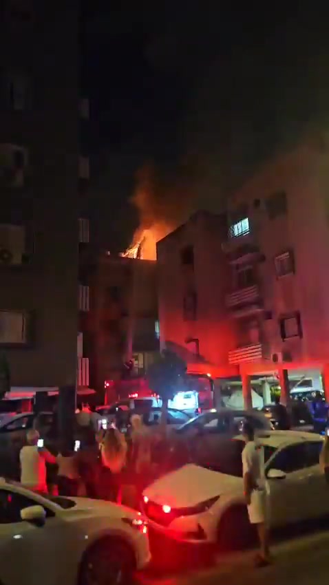 A fire broke out on the roof of a building in central Israel after debris from an interceptor fell during the latest Iranian missile attack
