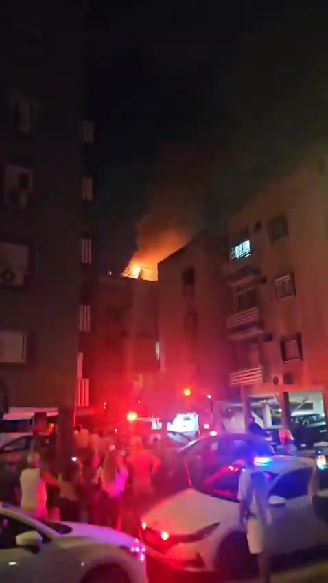 A fire broke out on the roof of a building in central Israel after debris from an interceptor fell during the latest Iranian missile attack
