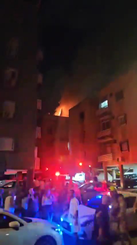 A fire broke out on the roof of a building in central Israel after debris from an interceptor fell during the latest Iranian missile attack