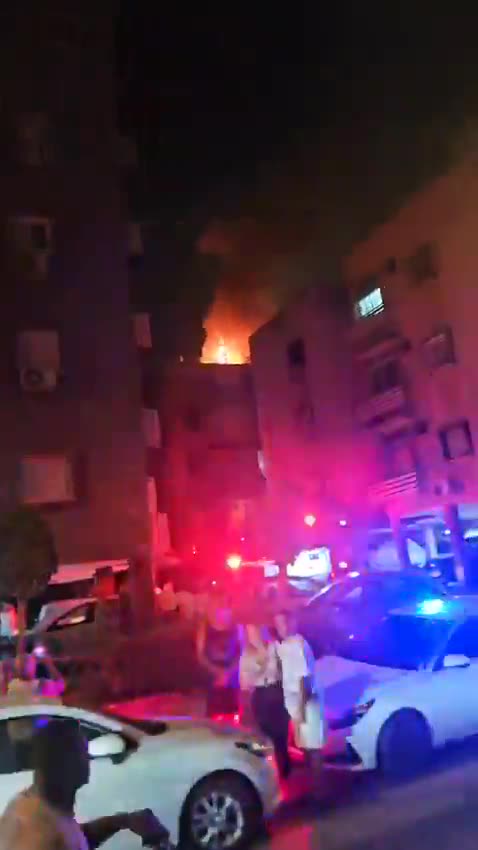 A fire broke out on the roof of a building in central Israel after debris from an interceptor fell during the latest Iranian missile attack