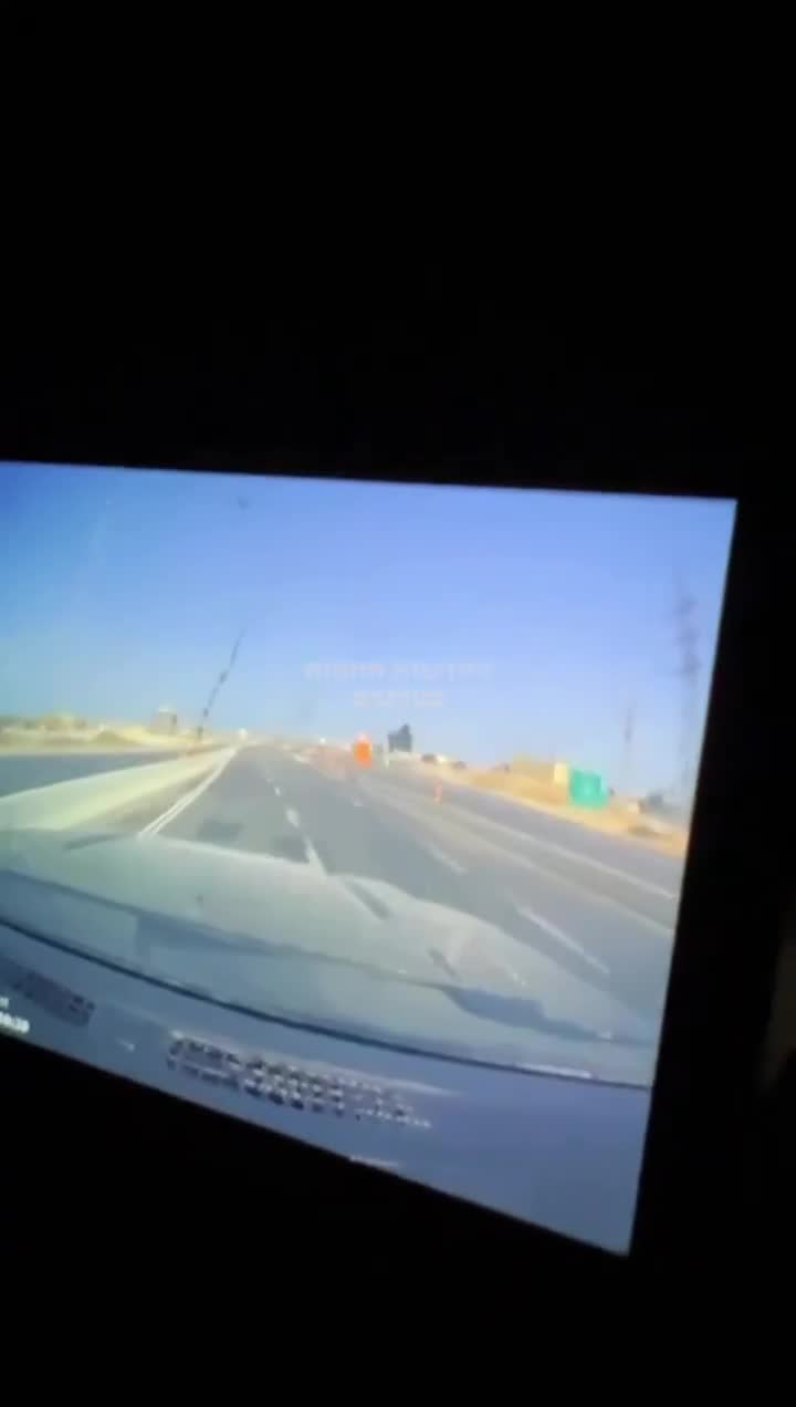 Dashcam footage showing the impact of an Iranian ballistic missile earlier near a power station in Ashdod, Southern Israel