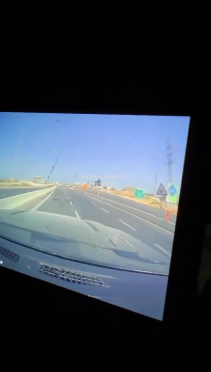 Dashcam footage showing the impact of an Iranian ballistic missile earlier near a power station in Ashdod, Southern Israel
