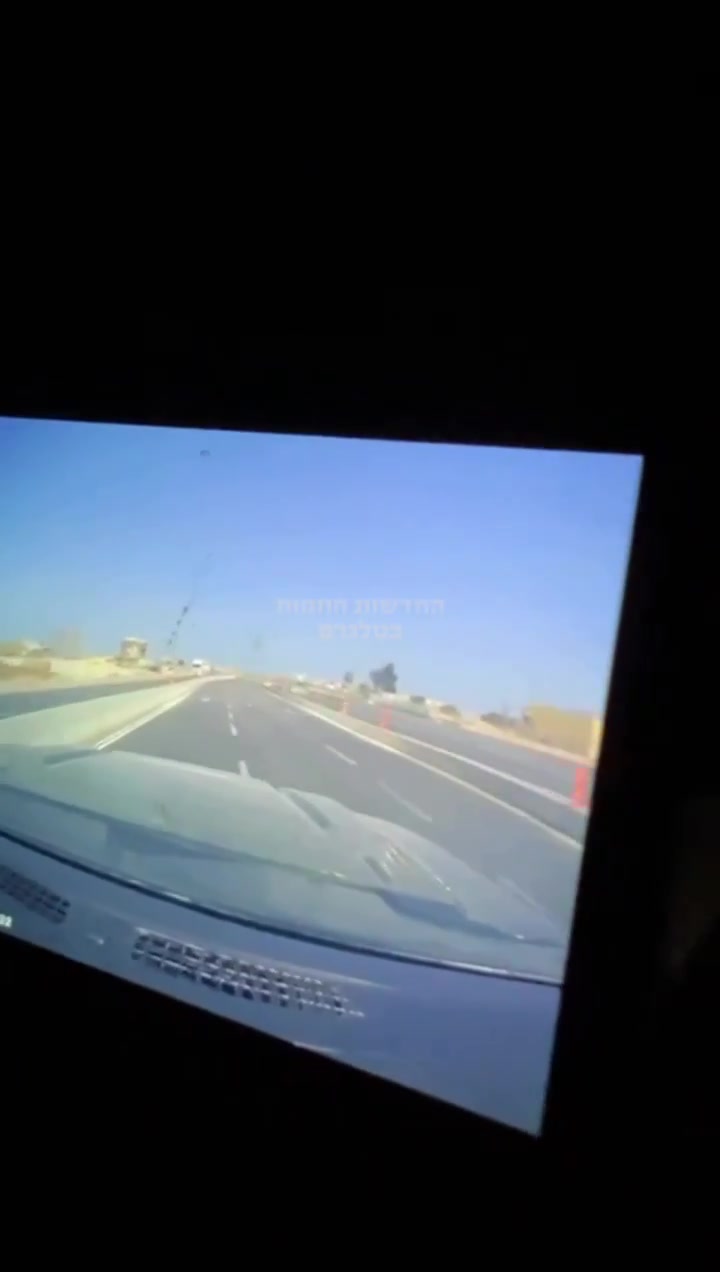 Dashcam footage showing the impact of an Iranian ballistic missile earlier near a power station in Ashdod, Southern Israel