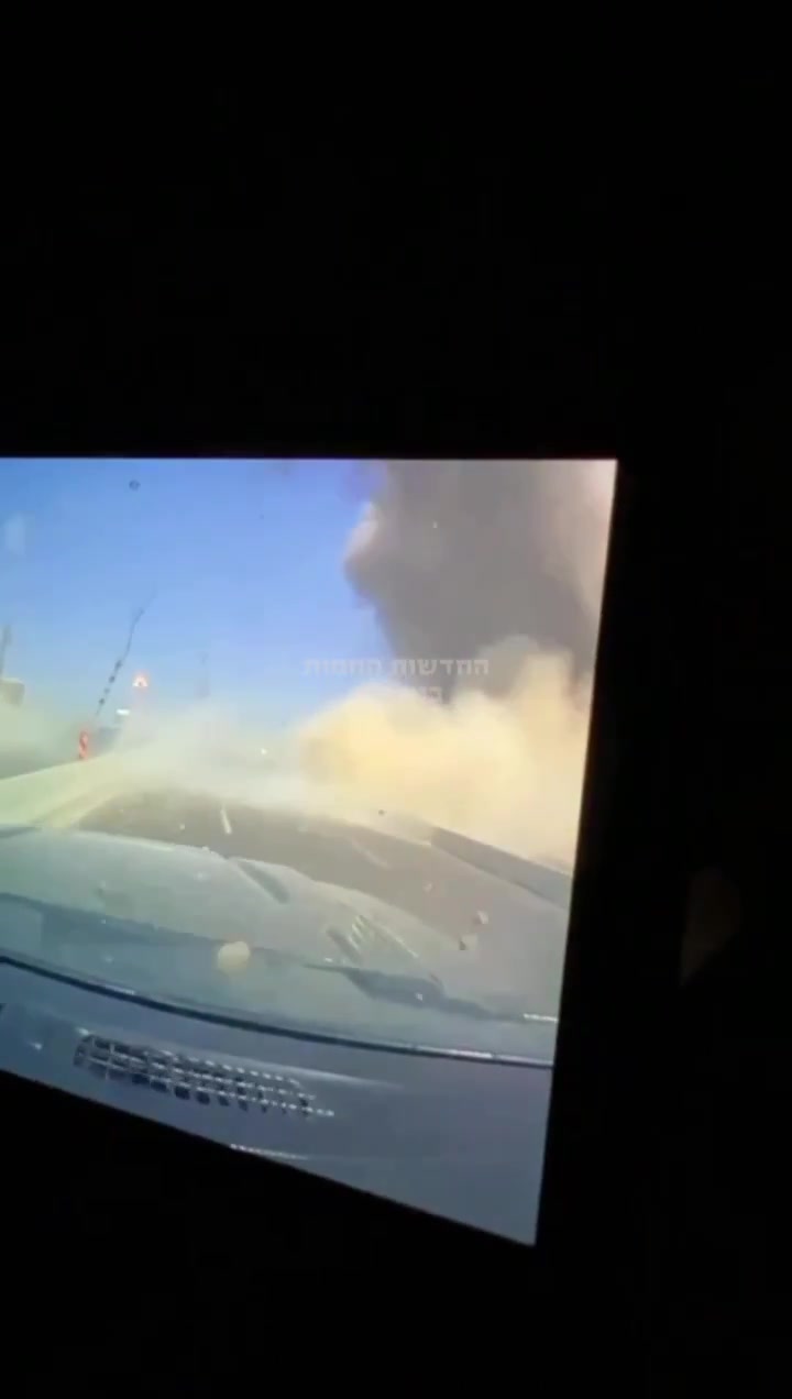 Dashcam footage showing the impact of an Iranian ballistic missile earlier near a power station in Ashdod, Southern Israel