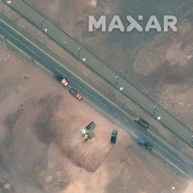 A lot going on at Fordow TODAY. Ventilation shaft and bomb penetration holes have been filled up. nn1. Large crane near large excavator working at old tunnel entrance. 2. Truck mounted borehole drilling rig parked nearby. 3. Trucks near tarmac road being filled up by bulldozer.