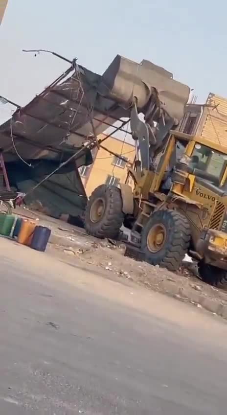 Iranshahr, southeast Iran: Security forces and municipal authorities used a loader to demolish the makeshift stalls and business sites of Baluch street vendors at Aminifard roundabout