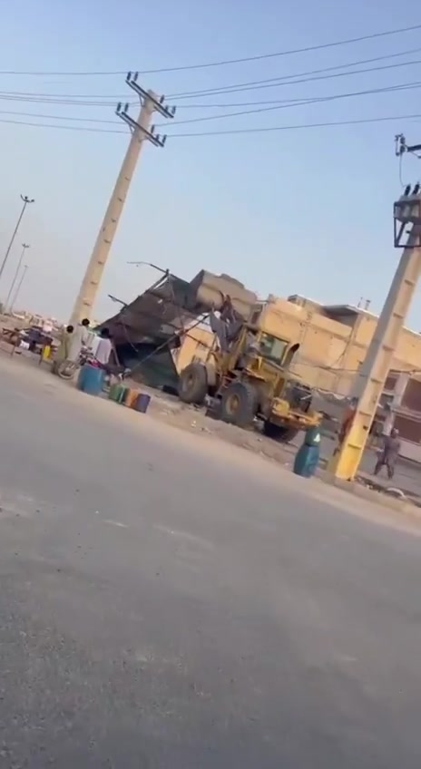 Iranshahr, southeast Iran: Security forces and municipal authorities used a loader to demolish the makeshift stalls and business sites of Baluch street vendors at Aminifard roundabout