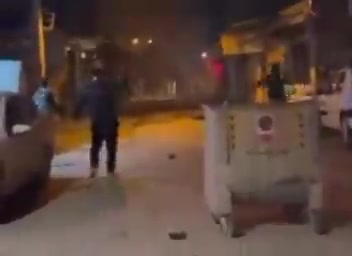 Direct clashes between Iranian protestors and regime security forces in the streets of Asadabad