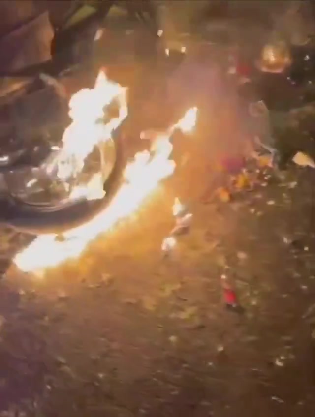 Rasht, N Iran Social media video of protesters setting fire to a motorcycle belonging to security forces who opened fire on them
