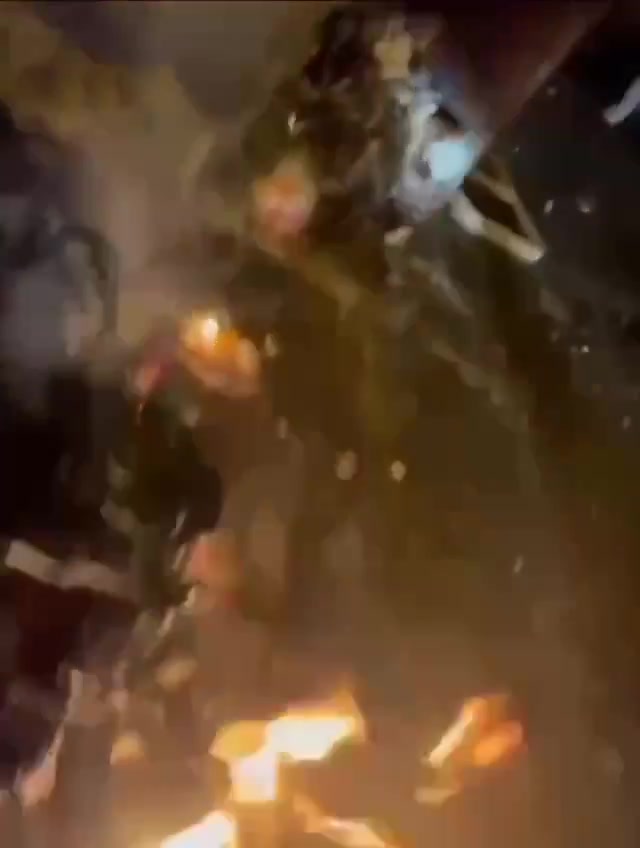 Rasht, N Iran Social media video of protesters setting fire to a motorcycle belonging to security forces who opened fire on them