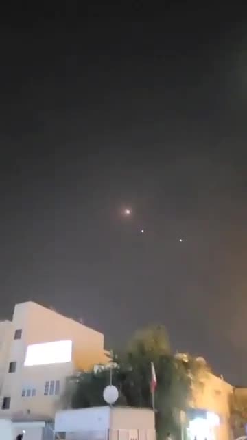Bahraini air defenses are intercepting several Iranian missiles over Manama