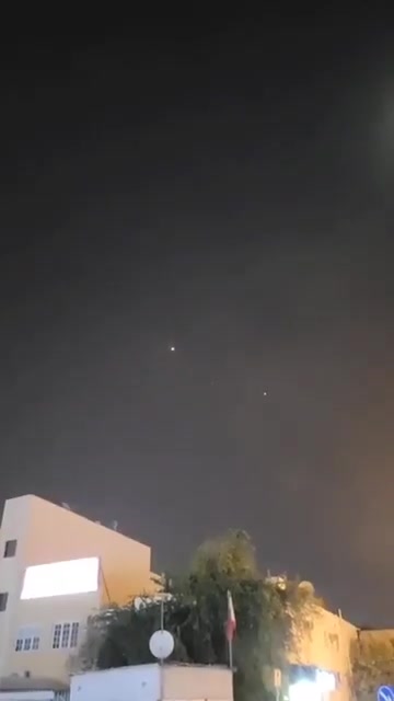 Bahraini air defenses are intercepting several Iranian missiles over Manama