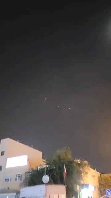 Bahraini air defenses are intercepting several Iranian missiles over Manama