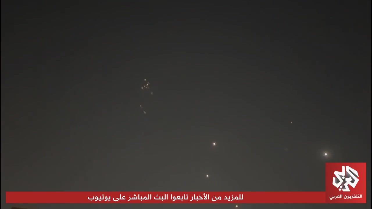 Footage shows air defenses intercepting Iranian missiles in Qatari airspace.