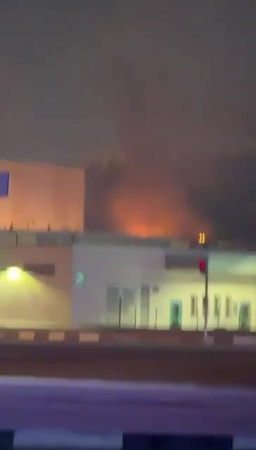 Smoke rises as a fire appears to be burning on the roof of one of the entrance buildings that are part of the U.S. Consulate in Dubai