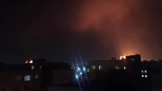 Intense airstrikes on Tehran; the sky is lit up by the force of the raids and explosions.