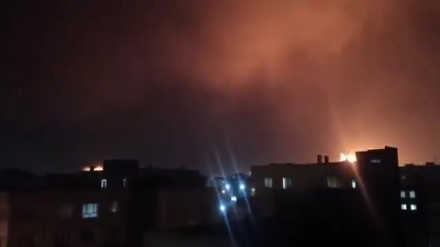 Intense airstrikes on Tehran; the sky is lit up by the force of the raids and explosions.