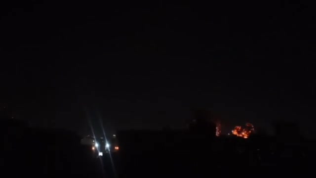 Intense airstrikes on Tehran; the sky is lit up by the force of the raids and explosions.