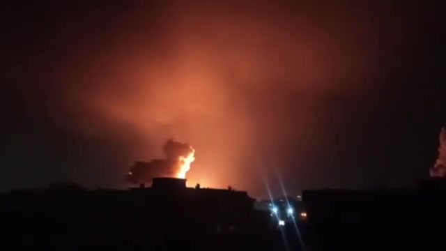 Intense airstrikes on Tehran; the sky is lit up by the force of the raids and explosions.