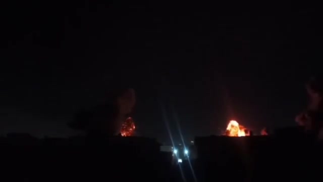 Intense airstrikes on Tehran; the sky is lit up by the force of the raids and explosions.