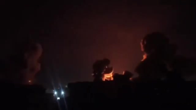 Intense airstrikes on Tehran; the sky is lit up by the force of the raids and explosions.