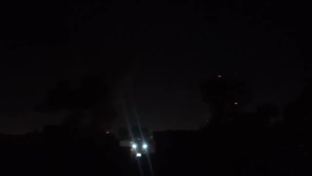 Intense airstrikes on Tehran; the sky is lit up by the force of the raids and explosions.