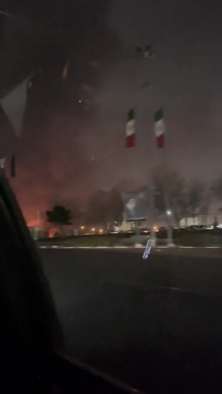 Smoke rising around Azadi Square a few minutes after it was hit