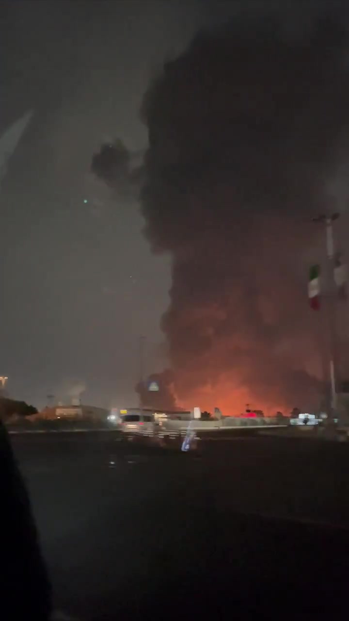 Smoke rising around Azadi Square a few minutes after it was hit