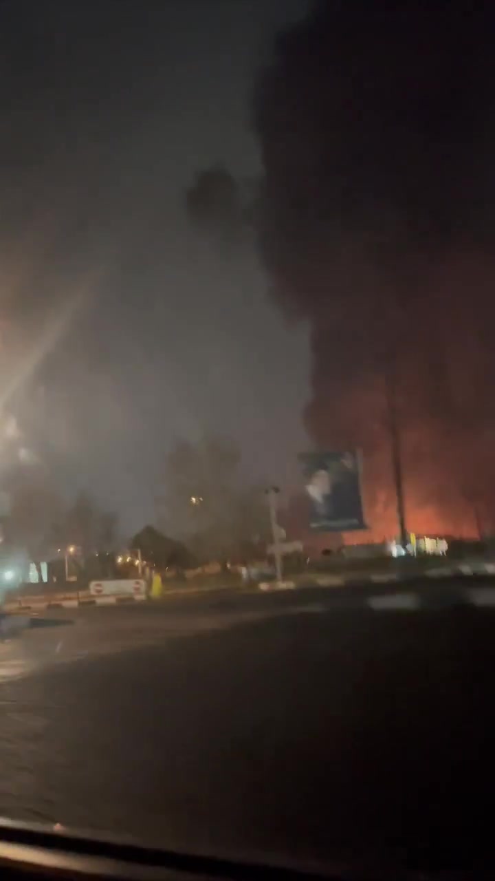 Smoke rising around Azadi Square a few minutes after it was hit