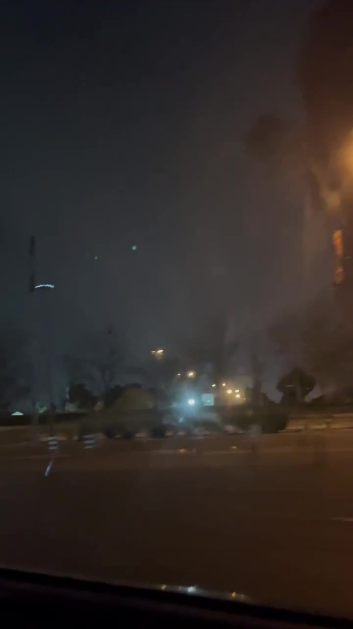 Smoke rising around Azadi Square a few minutes after it was hit
