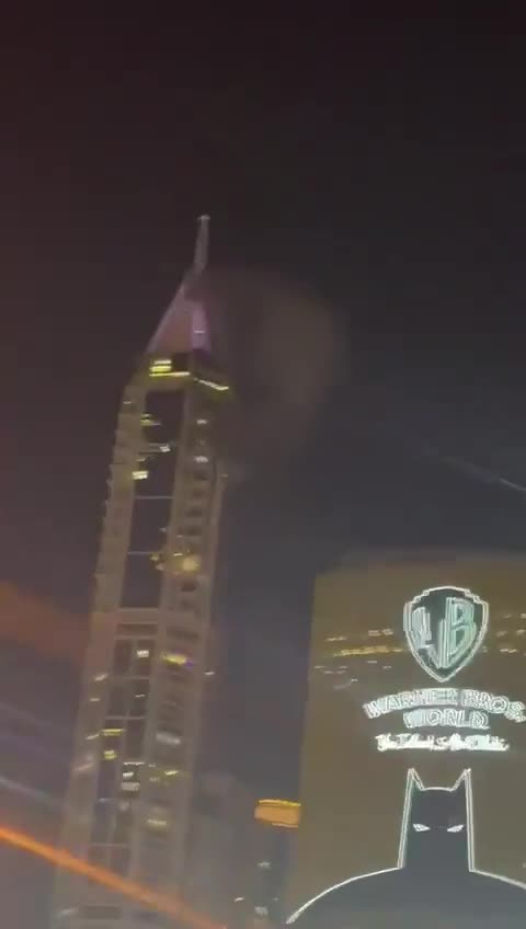 Smoke seen at the 23 Marina skyscraper in Dubai after being hit by debris from an interception. No injuries reported
