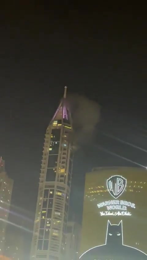 Smoke seen at the 23 Marina skyscraper in Dubai after being hit by debris from an interception. No injuries reported