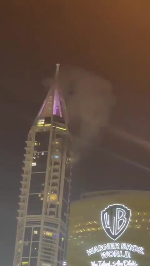 Smoke seen at the 23 Marina skyscraper in Dubai after being hit by debris from an interception. No injuries reported