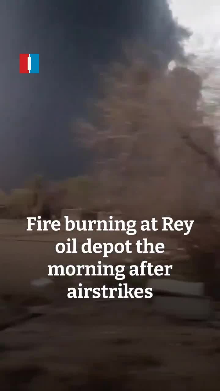 Fire is seen still burning at the Rey oil depot on Sunday morning, hours after the site, along with other oil depots in Tehran, was targeted in airstrikes late on Saturday, footage sent to Iran International shows