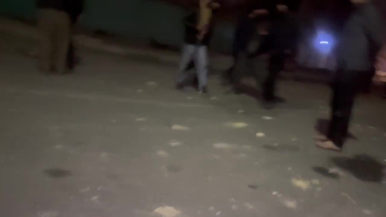 Residents in the Bisim district in south-east Tehran inspect the aftermath of a strike targeting the local police station, the roof of which appears to have been destroyed