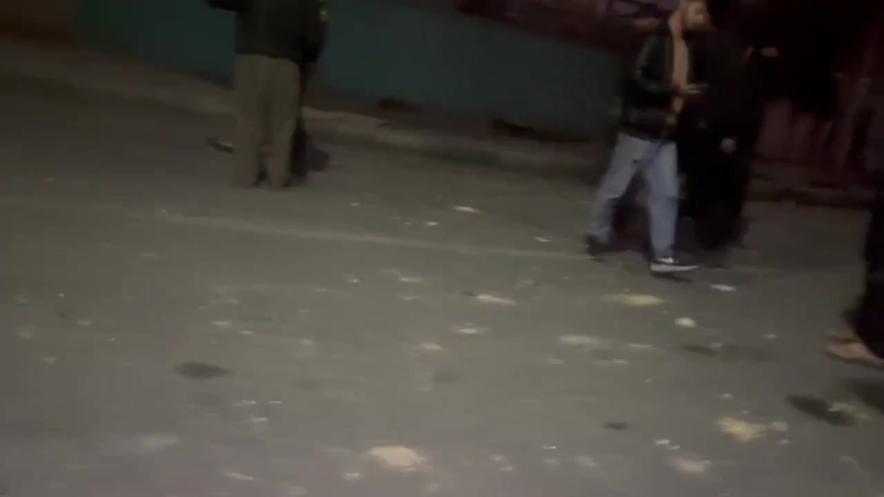Residents in the Bisim district in south-east Tehran inspect the aftermath of a strike targeting the local police station, the roof of which appears to have been destroyed