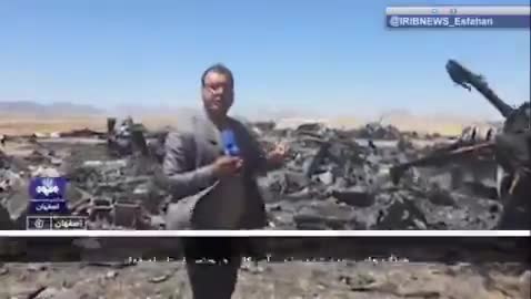 Iran’s state television report from the site of the wreckage of a U.S. aircraft and mentioning only two C-130s is destroyed. The reporter says this is the Parzan area in southern Isfahan
