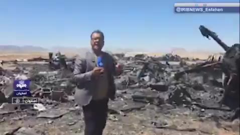 Iran’s state television report from the site of the wreckage of a U.S. aircraft and mentioning only two C-130s is destroyed. The reporter says this is the Parzan area in southern Isfahan