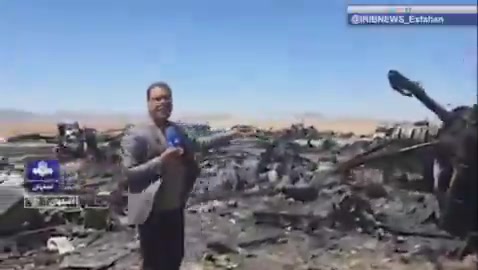 Iran’s state television report from the site of the wreckage of a U.S. aircraft and mentioning only two C-130s is destroyed. The reporter says this is the Parzan area in southern Isfahan