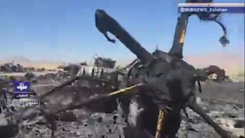 Iran’s state television report from the site of the wreckage of a U.S. aircraft and mentioning only two C-130s is destroyed. The reporter says this is the Parzan area in southern Isfahan