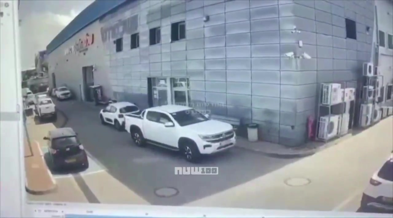 Video shows the moment when cluster submunitions from an Iranian missile struck a commercial area in Petah Tikva, Israel